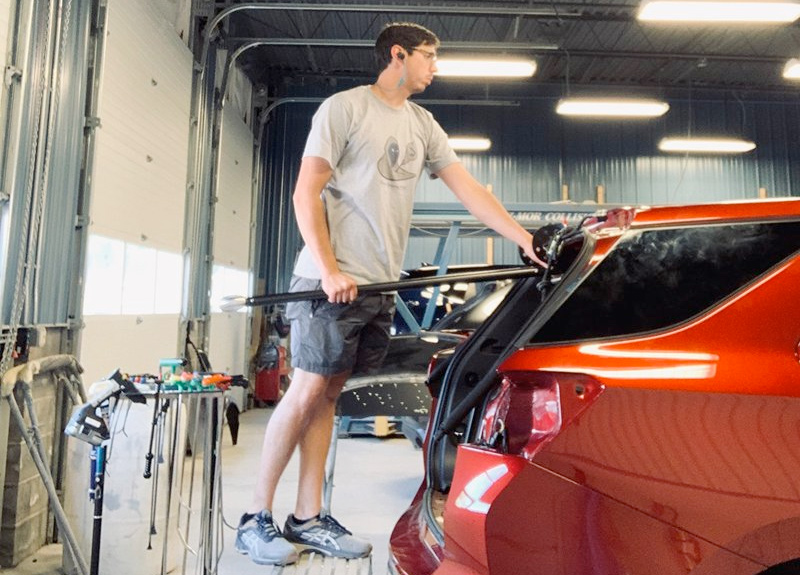 Michael Acevedo performing paintless dent repair process in Bethlehem PA